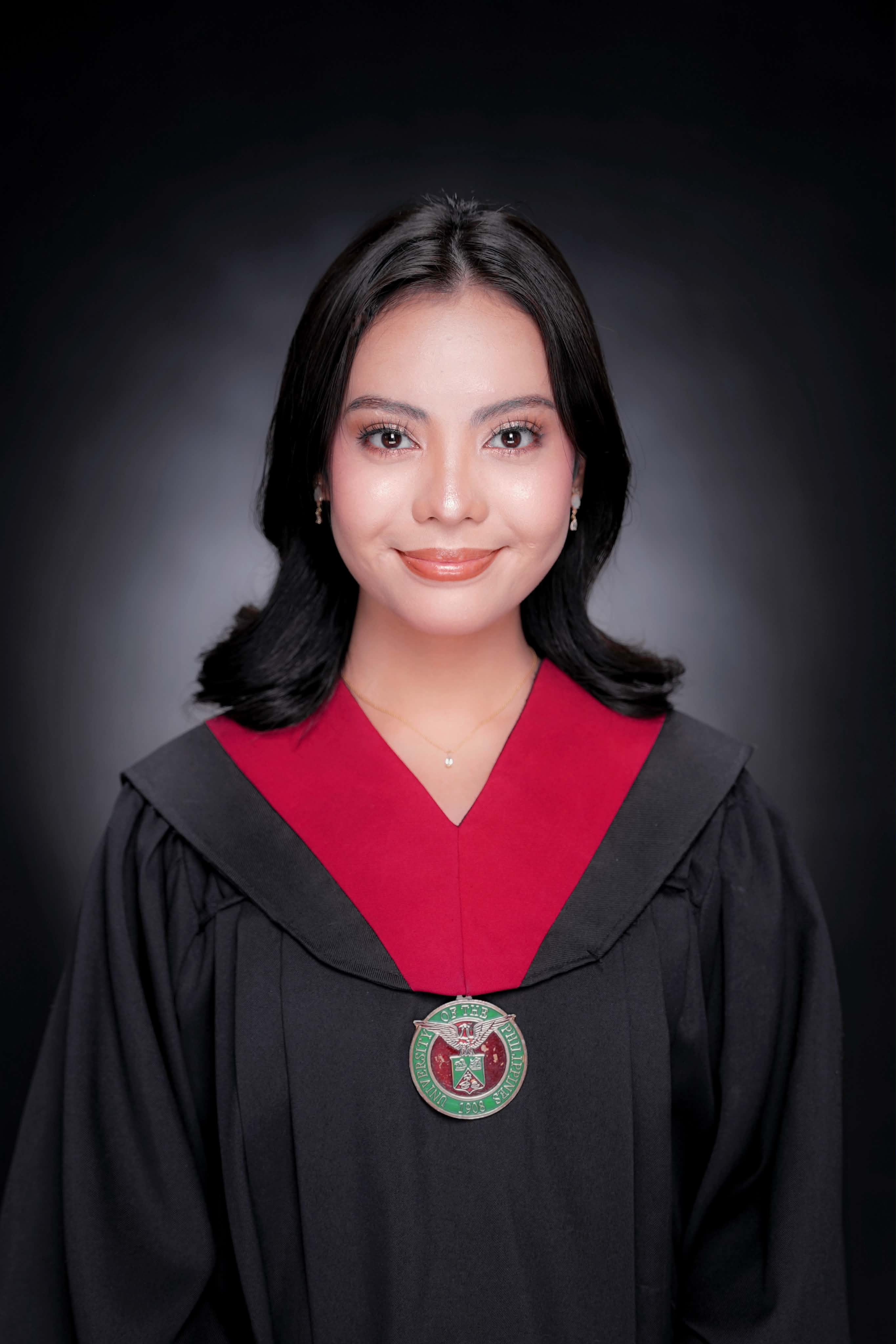 Nikole wearing the University of the Philippines toga