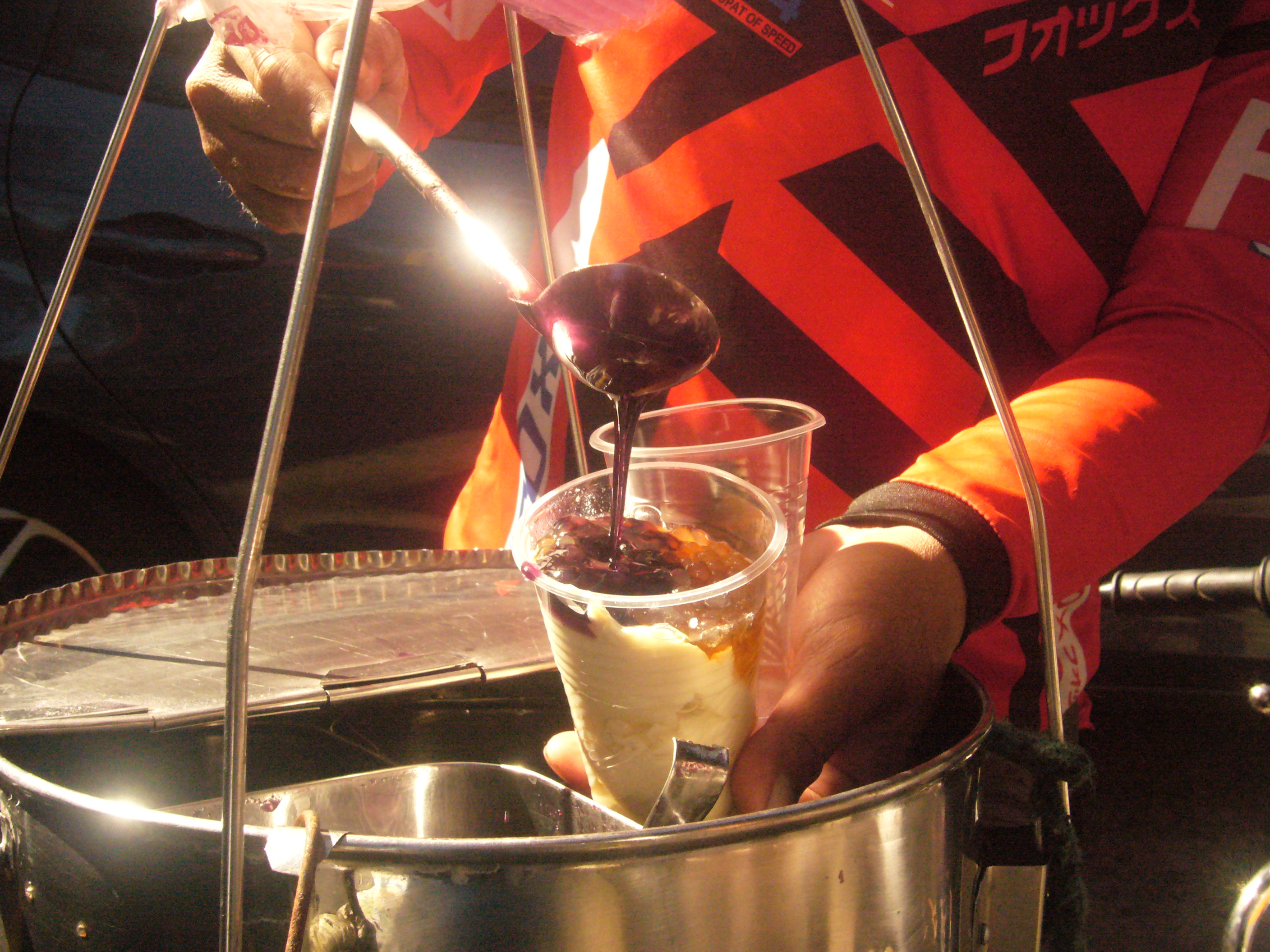 Preparing a taho dessert at a street stall