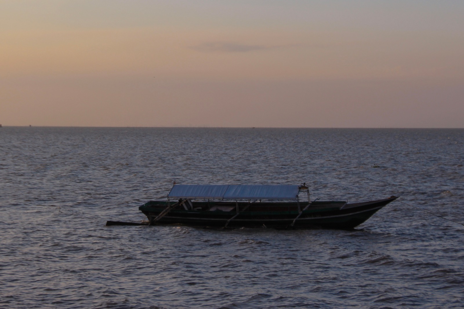 Boat on the sea at sunset